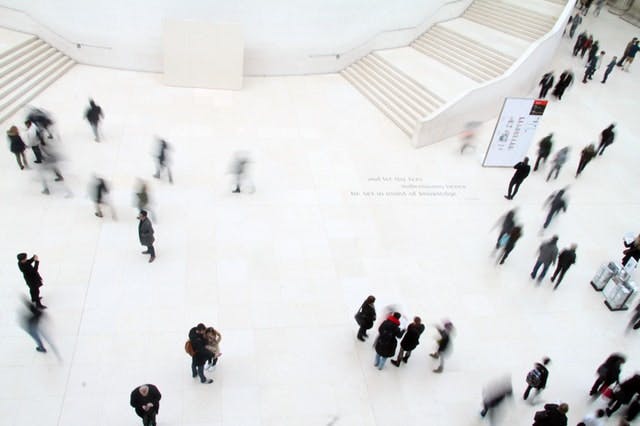 people walking on marble floor