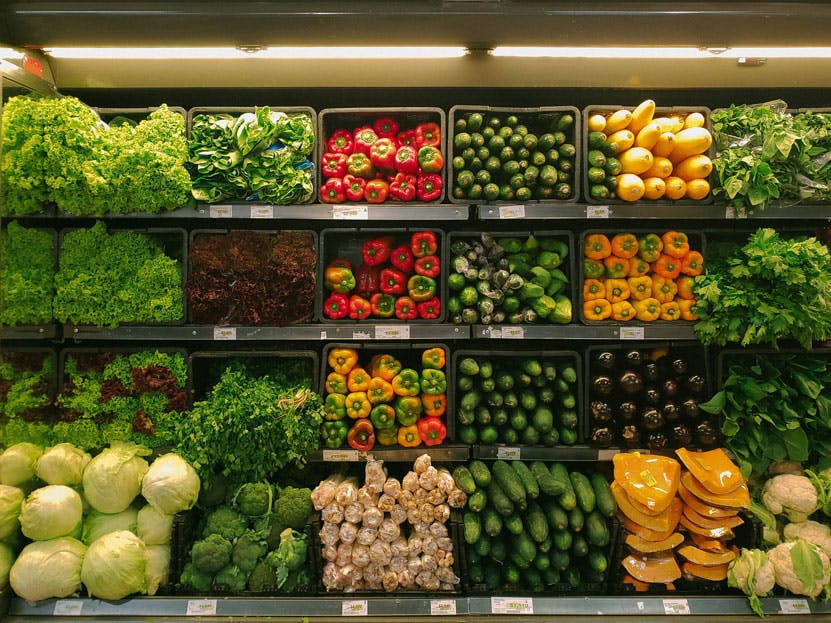 supermarket aisle with fruit and vegetables